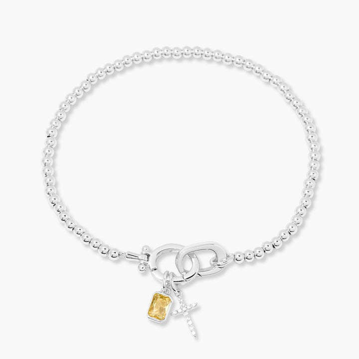 Kralenarmband met geboortesteen en kruisje
